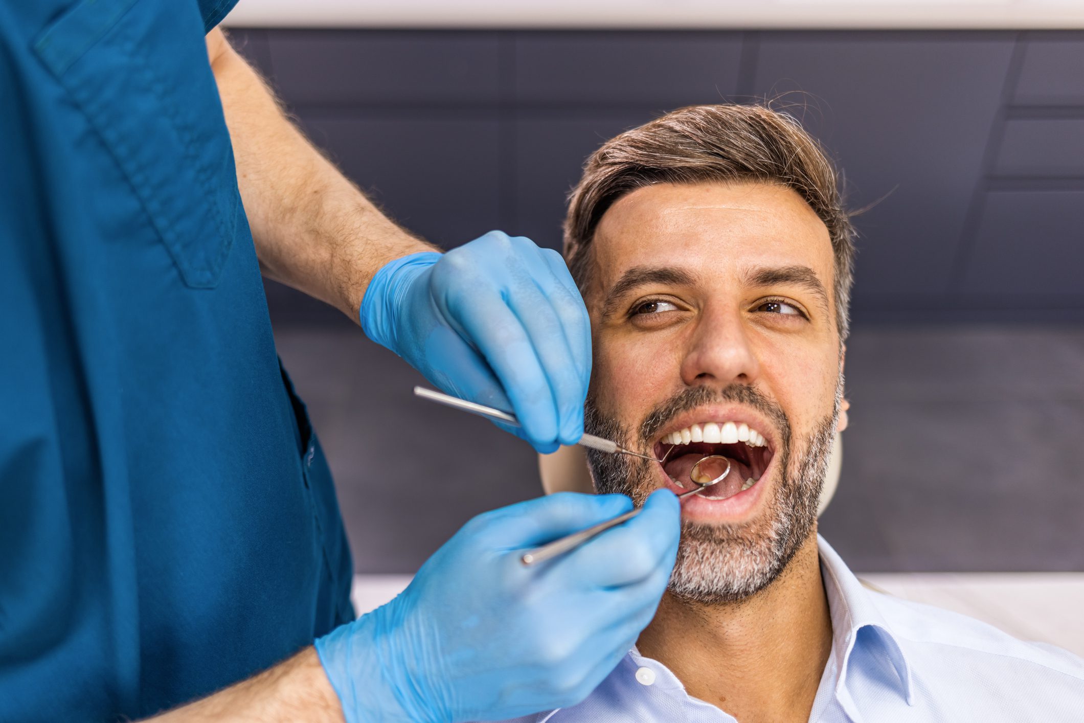 Patient Being Examined By Dentist